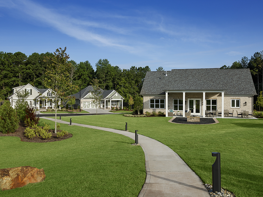 A beautiful central park and clubhouse at a Windsong community